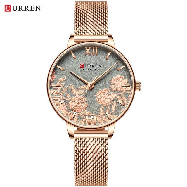 Montre élégante pour femmes étanche avec design de fleurs en découpage