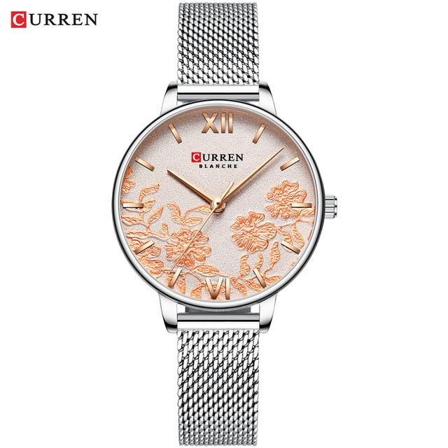 Montre élégante pour femmes étanche avec design de fleurs en découpage