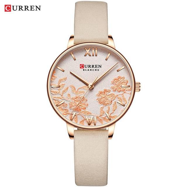 Montre élégante pour femmes étanche avec design de fleurs en découpage