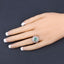 2.57 Carat Emerald and White Topaz Halo Ring in Sterling Silver