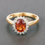 Anillo de 1.87 quilates de granate espessartita y diamante en oro amarillo de 14 quilates