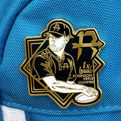 Pin del Campeón del Mundo Isaac Robinson - Edición Limitada