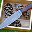 Wilderness Guardian: Premium Damascus Steel Bowie Knife with Rosewood Handle & Leather Sheath - Korvel