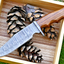Wilderness Guardian: Premium Damascus Steel Hunting Knife with Rosewood Handle and Leather Sheath - Korvel