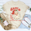 Camiseta de Papá Noel tiene la idea correcta: visita a la gente una vez al año
