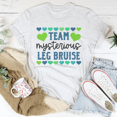 Camiseta del Equipo de Moretones Misteriosos en la Pierna