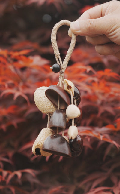 The Deep Woods Rattle - Dark Nut & Hollow Pod Cluster Charm