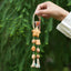 La Estrella Feliz - Encanto de Bolsa de Madera Tallada con Sonrisa y Pan Tostado