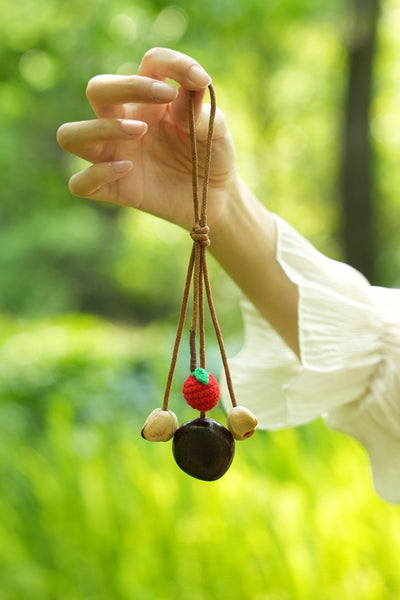 The Little Harvest - Minimalist Seed Charm with Micro-Crocheted Fruit