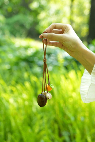 The Little Harvest - Minimalist Seed Charm with Micro-Crocheted Fruit