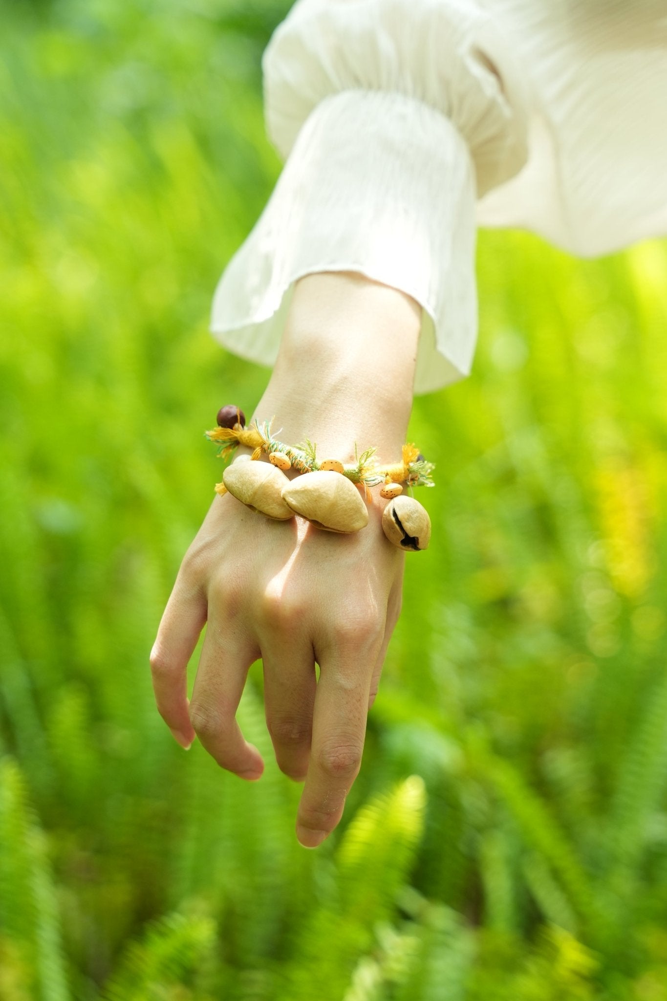 The Meadow Dancer - Yellow & Green Braided Bracelet with Natural Seed Bells