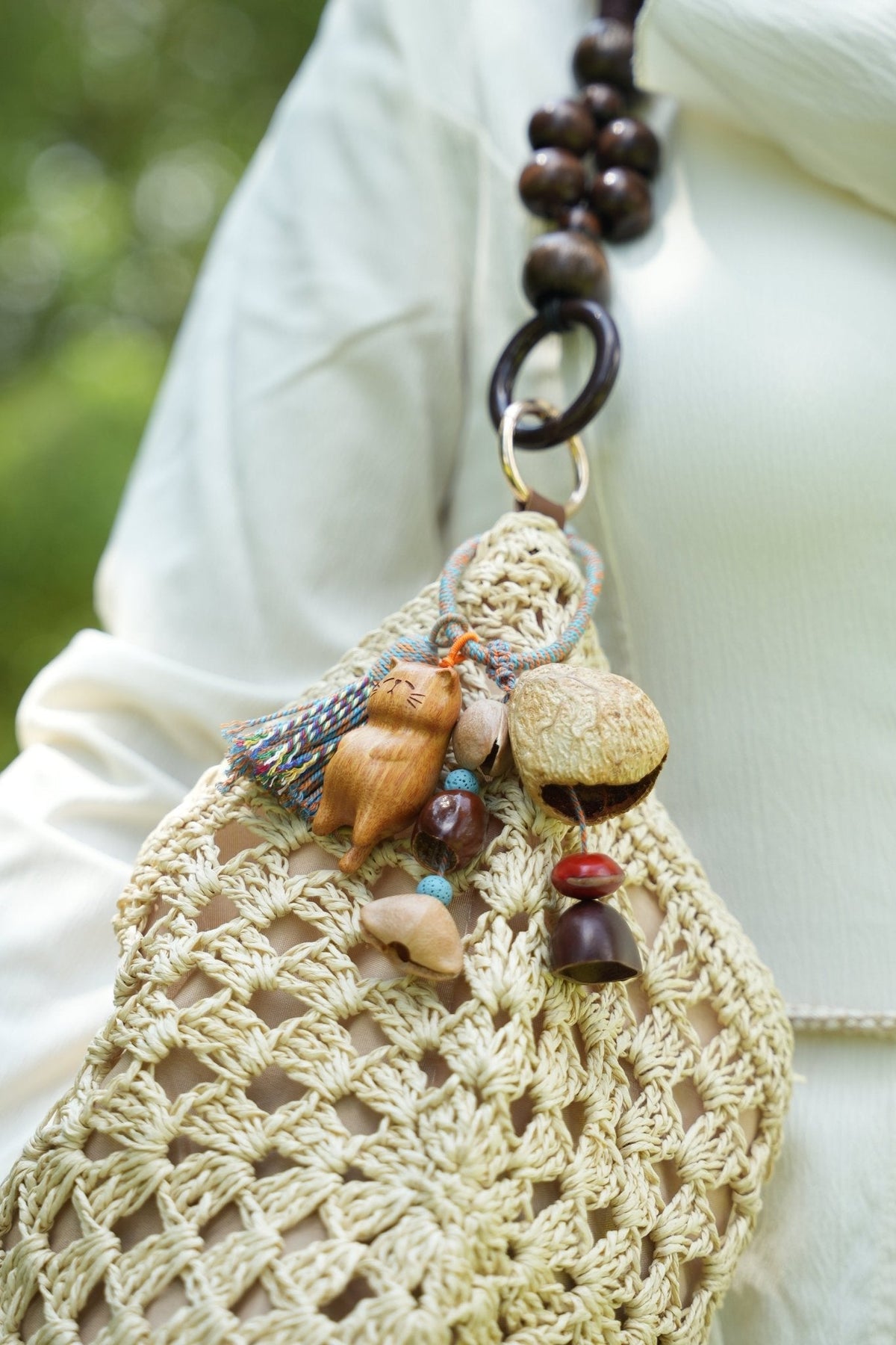 The Naptime Kitty - Hand-Carved Wooden Cat Charm with Natural Seeds & Tassel