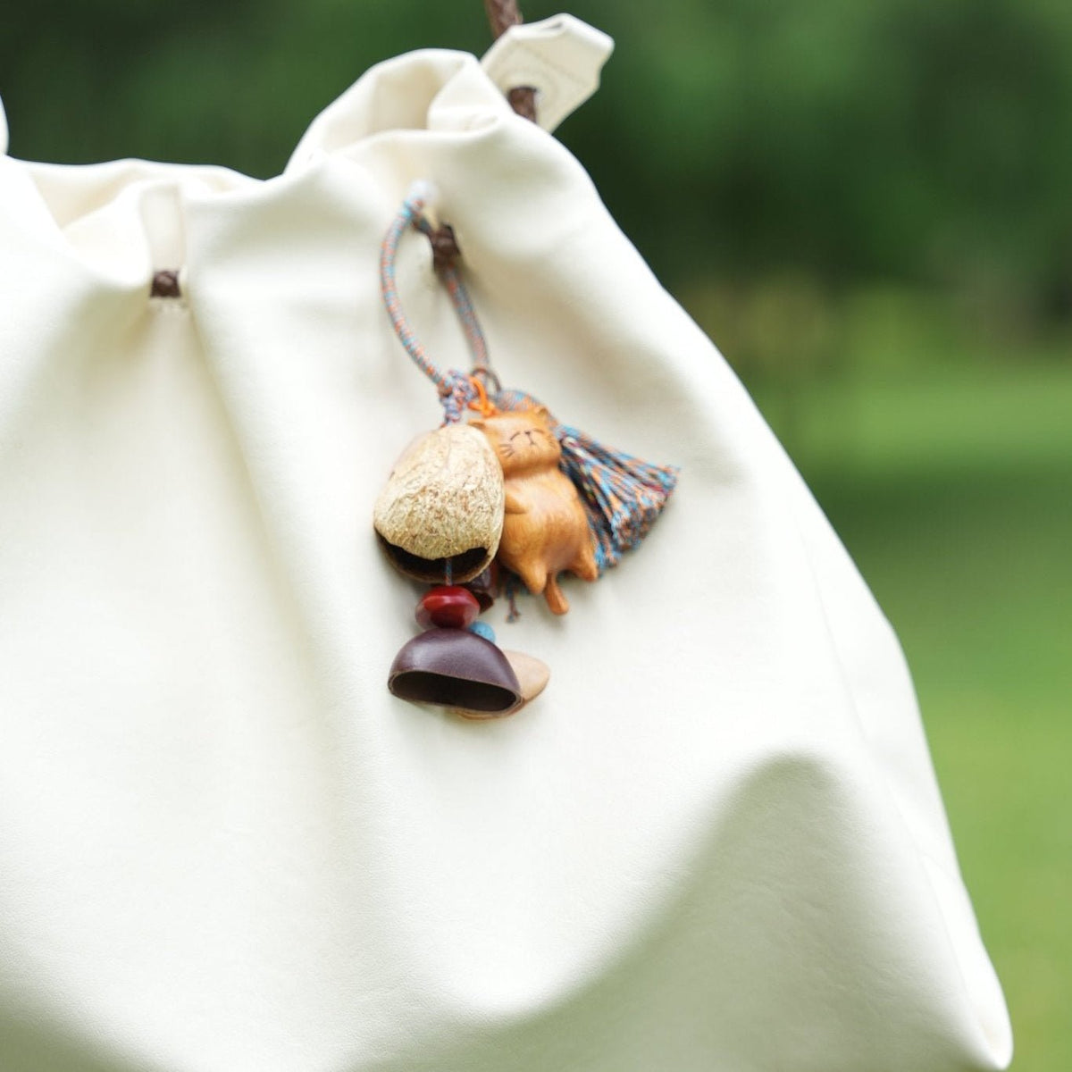 The Naptime Kitty - Hand-Carved Wooden Cat Charm with Natural Seeds & Tassel