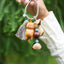 The Naptime Kitty - Hand-Carved Wooden Cat Charm with Natural Seeds & Tassel