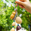 The Naptime Kitty - Hand-Carved Wooden Cat Charm with Natural Seeds & Tassel