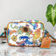 Bolso cruzado Dooney & Bourke Disney El Libro de la Selva
