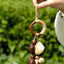La Canción de la Tierra - Charm de Bolsa con Anillo de Madera Envuelto a Mano y Vaina Fibrosa