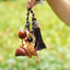 The Guardian Lion - Hand-Carved Wood Bag Charm with Tassel & Seed Bell