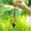 The Little Harvest - Minimalist Seed Charm with Micro-Crocheted Fruit