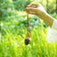 The Little Harvest - Minimalist Seed Charm with Micro-Crocheted Fruit