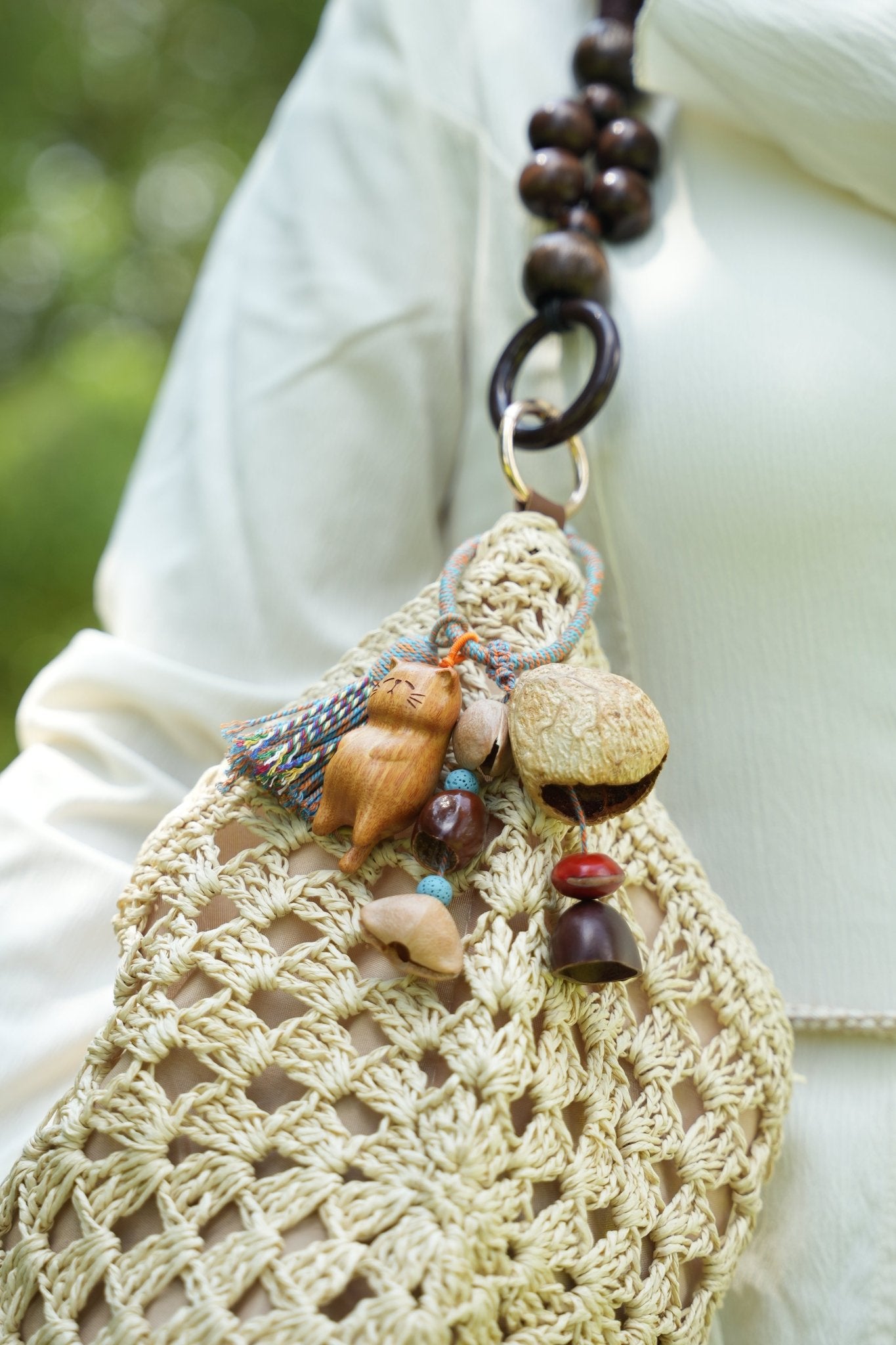 The Naptime Kitty - Hand-Carved Wooden Cat Charm with Natural Seeds & Tassel