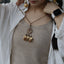 The Sunset Weaver - Bronze Woven Mandala Necklace