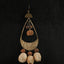L'Écho Tribal - Boucles d'oreilles en bronze martelé asymétriques et graines naturelles
